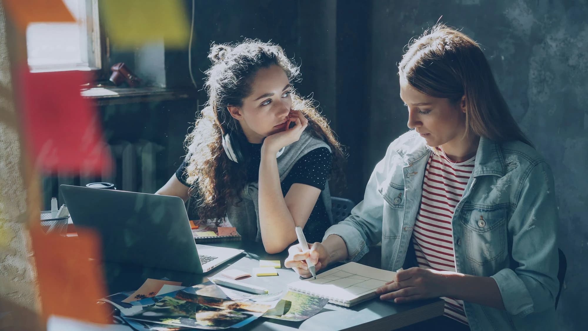 Two collaborators listening and working through an idea together